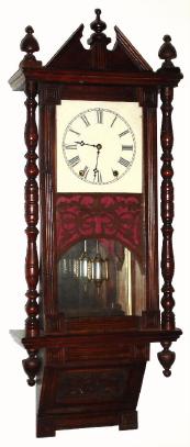 C.1875, Anglo-American, mahogany parlor wall clock, with turned columns and a mirror in the case back. — Antique Clocks Price Guide