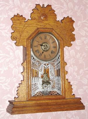 C.1894, Ansonia Clock Co., 8-day time and strike, oak gingerbread kitchen clock. — Antique Clocks Price Guide