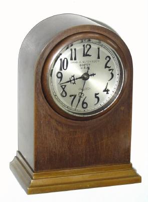 C.1925, Chelsea, Mini Round Gothic in bronze with 2.5" Special Dial with raised bronze numerals and special hands, sold through Chas. O. Hutchinson, BOSTON (dial signed). — Antique Clocks Price Guide