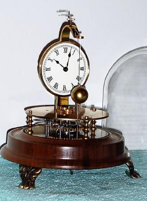C.1975, Horolovar Co., "Briggs Rotary" 8-day reproduction novelty timepiece in very good condition with original dome. — Antique Clocks Price Guide