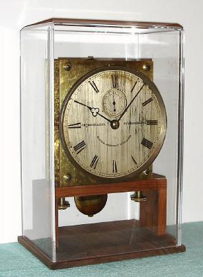 C.1890, English, H. M. Emanuel and Son (Portsea), By Special Appointment to the Queen, fusee laboratory movement, now on a walnut stand with glazed cover. — Antique Clocks Price Guide
