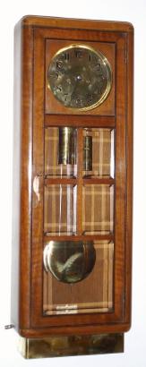 C.1920, German, 2-Weight, Jugendstil regulator, time and gong strike, in a rounded edge walnut case with ebony trim and 5 panes of beveled glass. — Antique Clocks Price Guide