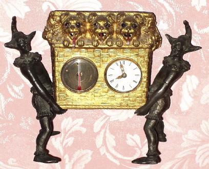 C.1875, German, Mayer, Tongue Animation, 3-Dogs in Basket, held by 2 jesters, one day pendulum novelty. — Antique Clocks Price Guide
