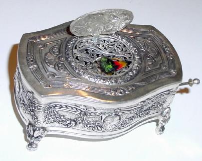 20th Century, German, Griesbaum, Singing Bird box, in an embossed Sterling Silver case, key wound, pull lever to activate. — Antique Clocks Price Guide