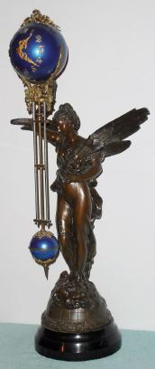 C.1900, Ansonia, GLORIA BALL SWING, patinated spelter mystery swinging timepiece, 8-day. — Antique Clocks Price Guide