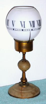 C.1890, French, Annular dial  night clock, with an open ended globe that can accommodate a small candle. — Antique Clocks Price Guide