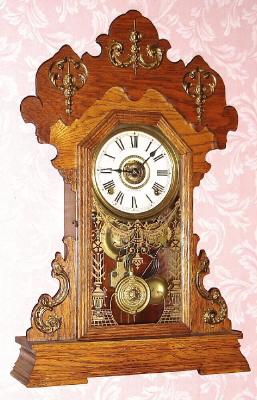 C.1900, Seth Thomas Clock Co., "Metals No. 1", 8-day time/strike/alarm gingerbread clock. — Antique Clocks Price Guide
