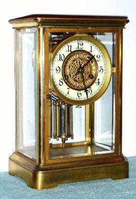 C.1920, Waterbury Clock Co., "Toulon", 8-day time and gong strike crystal regulator. — Antique Clocks Price Guide
