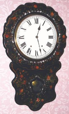C.1875, Anglo-American Papier-mache wall clock, with an open spring time and strike movement, probably New Haven. — Antique Clocks Price Guide