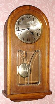 C.1920, German, Westminster Chime wall clock, 8-day, spring driven, in a round top oak case, less top glass. — Antique Clocks Price Guide
