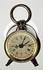 C.1900, Parker Clock Co., Meriden, Conn, Calendar Alarm clock, in a nickeled case with original handle and feet. 