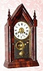 C.1886, New Haven Clock Co., "Small Gothic, VP" 30-hour time/alarm steeple clock. 