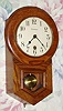 C.1930, Waterbury Clock Co., "6 Inch Drop" 8-day schoolhouse style oak timepiece. This also looks like the Daintie No. 1 model. 