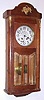 C.1915, French, 8-day time and rod strike oak cased wall clock, with heavy beveled glass in the door and ormolu trim. 