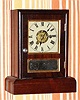 C.1880, Seth Thomas Clock Co., "Cottage E", 30-hour time and alarm rosewood cottage clock. 
