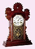 C.1895, E. Ingraham and Co., "Tulip", 8-day time/strike walnut cased gingerbread clock. 
