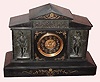 C.1890, French, Black Slate and Bronze mantel clock, 8-day, gong strike with frieze across the top and a figure either side of the dial in 17C ruffles and tights dress. 