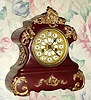 C.1906, Waterbury Clock Co., "Susa Wine", 8-day time gong strike, enameled iron mantel clock. 
