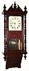 C.1875, Anglo-American, mahogany parlor wall clock, with turned columns and a mirror in the case back. 