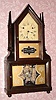 C.1980, Copy of an Ives 30-day timepiece wagon spring steeple on frame with candle finials shelf clock. 