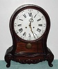 C.1900, German, Muller and Co., Muhlheim an Donau, mahogany mantel clock in the Swiss Neuchatel style, 8-day, quarter striking on double gong assembly, serial No. 16908. 