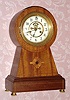 C.1913, Waterbury Clock Co., "Surrey", 8-Day mahogany mantle clock, keyhole style case, with inlay and open escapement on the dial. 