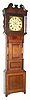 C.1840, English, Jn. Hughes, Carnarvon, Square dial tall case, 8-day, in a wide, short door case, with attractive oak and mahogany veneers. 