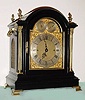 C.1890, English, Triple Fusee Bracket Clock, ebonized mahogany case with brass OG feet and flame finials, playing your choice of Whittington or Cambridge tunes on the quarter hour. 