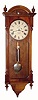 C.1885, Seth Thomas, Thomaston, Conn,  "Regulator No. 6", in walnut, single weight, wall model with nickel appointments. 