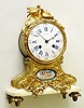 C.1860, French, Hatton a'Paris, Ormolu  and marble mantel, surmounted by two finely chased doves, and below the dial a porcelain china plaque with a hand painted cherub floating in the clouds. 