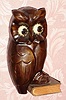 C.1930, German, Oswald, WISE OLD OWL, rotating eye timepiece , molded composition body on a carved wooden book base. 