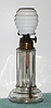 C.1890, American, Novelty oil lamp that displays the time as the oil is used up.