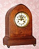 C.1910, Waterbury Clock Co., "Sussex", 8-day time and strike mantel clock in mahogany, open escapement on the dial.. 