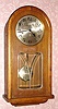 C.1920, German, Westminster Chime wall clock, 8-day, spring driven, in a round top oak case, less top glass. 