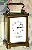 C.1910, French, Brass Cased Carriage  timepiece, in a souvenir style Obis case [pressed brass], and with cylinder platform intact, retailed by The Mauser Mfg. Co, New York. 