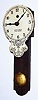 C.1923, (dated label on rear) American, 30-hour pendulette, mini "marble" wall clock, with "Uncle Sam's Little Wonder" printed on the dial. 