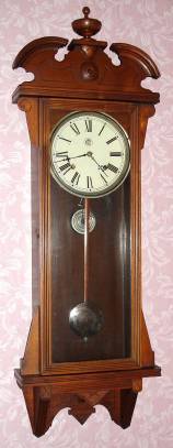 C.1893, Waterbury Clock Co., CARLETON, walnut cased, 8-day time and strike wall clock. — Antique Clocks Price Guide