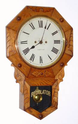 C.1900, New Haven Clock Co., "BLAKE", oak cased, short drop octagon with carved trim, 30 day timepiece. — Antique Clocks Price Guide