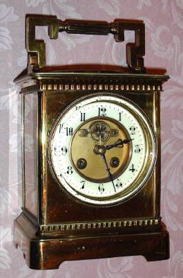 C.1900, French, Brass Cased carriage timepiece, oversize [10.25"], with exposed and cut out platform lever on the dial center, and with circular thermometer and compass in the top of the clock. — Antique Clocks Price Guide