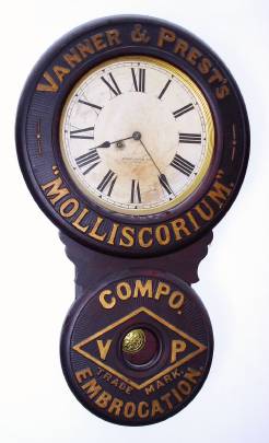 C.1890, Baird Clock Co., Plattsburgh, NY, ad clock for "Vanner and Prest's Molliscorium, compo Embrocation", 8-day spring driven timepiece. — Antique Clocks Price Guide