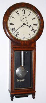 C.1886, Seth Thomas Clock Co., "Regulator No. 1", in walnut with burled walnut door and bezel, 8-day timepiece, with nickeled weight and damascene pendulum. — Antique Clocks Price Guide