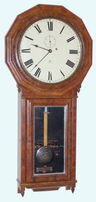 C.1885, Seth Thomas Clock Co., "Regulator No. 3", 8-day wall timepiece in burled walnut, with nickel finish on weight and damascene pendulum, large trapezoidal movement with cut pinions. — Antique Clocks Price Guide