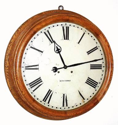 C.1909, Seth Thomas clock Co., "Gallery-24" Dial", in oak, fifteen day timepiece with large model 86 movement, with a pendulum length [from center shaft to rating nut] of 12.5", with No. 22 bob, 3 11/16" diameter, and iron bracket. — Antique Clocks Price Guide