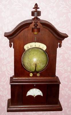 C.1864, L. E. Whiting, Saratoga Springs, NY, "Timby Solar Time-Piece, No. 288, mahogany case with double 12 hour dial, 6" terrestrial globe, and minute dial below. The patent for this hard to find clock was held by Theodore R. Timby, who designed the clock and developed the movement. — Antique Clocks Price Guide