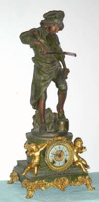 C.1904, Ansonia Clock Co., SYBIL and MELODY, cast figural clock, 8- day time and strike and with fancy porcelain dial. — Antique Clocks Price Guide