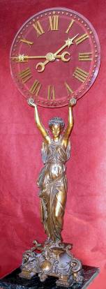 C.1890, French, Large Mystery Clock, the movement contained within the center hub of the minute hand, both hands mounted to a central axel on a heavy glass dial. — Antique Clocks Price Guide