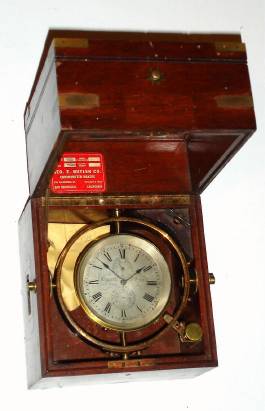 Mixed lot chronometer, C.1855, Eggert and Son, New York, 2-day marine chronometer, No. 968, now in a C.1900 English brass cornered box with flush handles, that is too large for the small movement. [see internet, the Eggerts were very influential in the chronometer field, and Simon Willard, Jr., even apprenticed briefly to Dominic Eggert). — Antique Clocks Price Guide