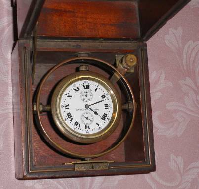 C.1911, Elgin National Watch Co., 18S , 21j, deck watch with 40-hour up down indicator in a gimbaled mahogany Elgin box. 21-jeweled movement adjusted for 3 positions with the serial no. 16,748,608. This model was made only for 2 years, succeeded by "Father Time" models. — Antique Clocks Price Guide