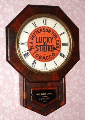 C.1890, New Haven, Drop Octagon, RC, with original "Lucky Strike" advertising dial for distributor R. A. Patterson Tobacco Co., this one for the Maine retailer named Shaw, Hammond and Garney, Portland, Maine [on bottom tablet], and with rear label. — Antique Clocks Price Guide