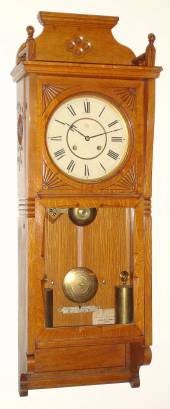 C.1883, Seth Thomas Clock Co., "FLORA" in golden oak, 8-day, 2-weight, time and gong strike. — Antique Clocks Price Guide